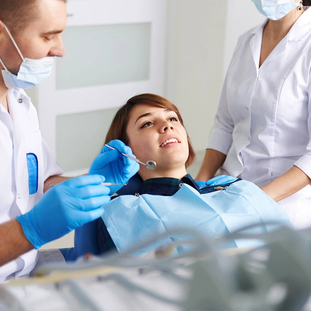 Dentist talking to patient