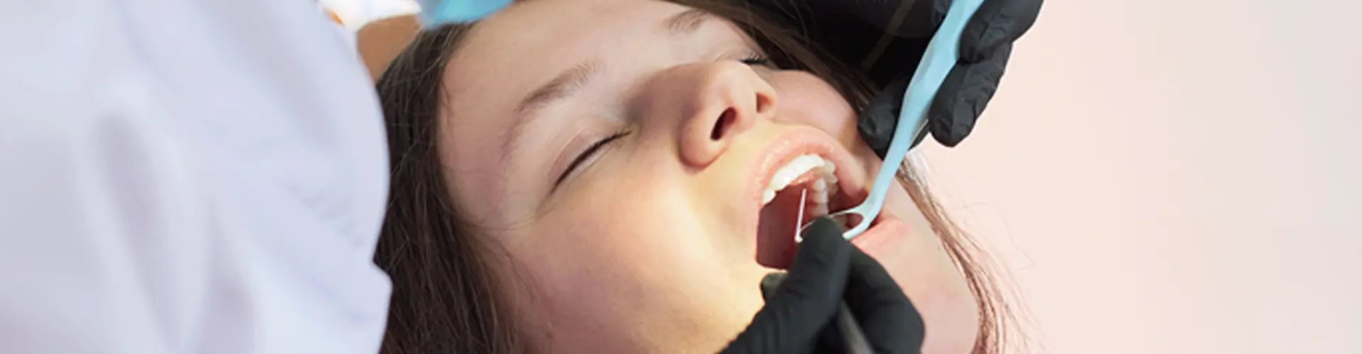 Dentist attending patient