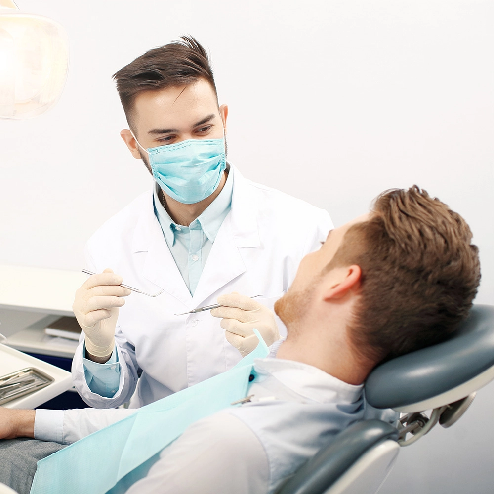 Dentist talking to patient before work