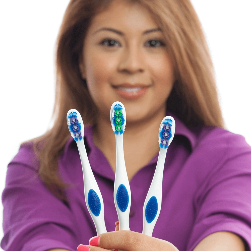 Assistant showing toothbrushes