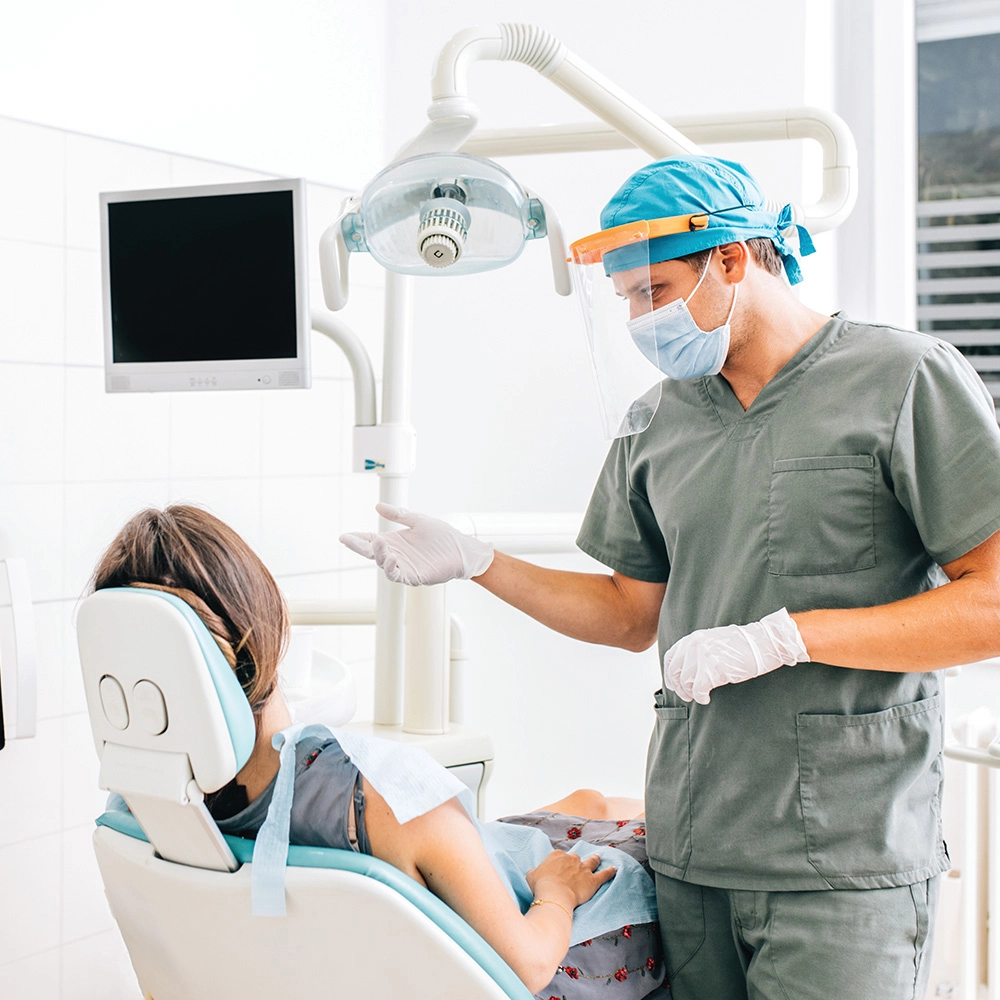 Dentist talking to patient