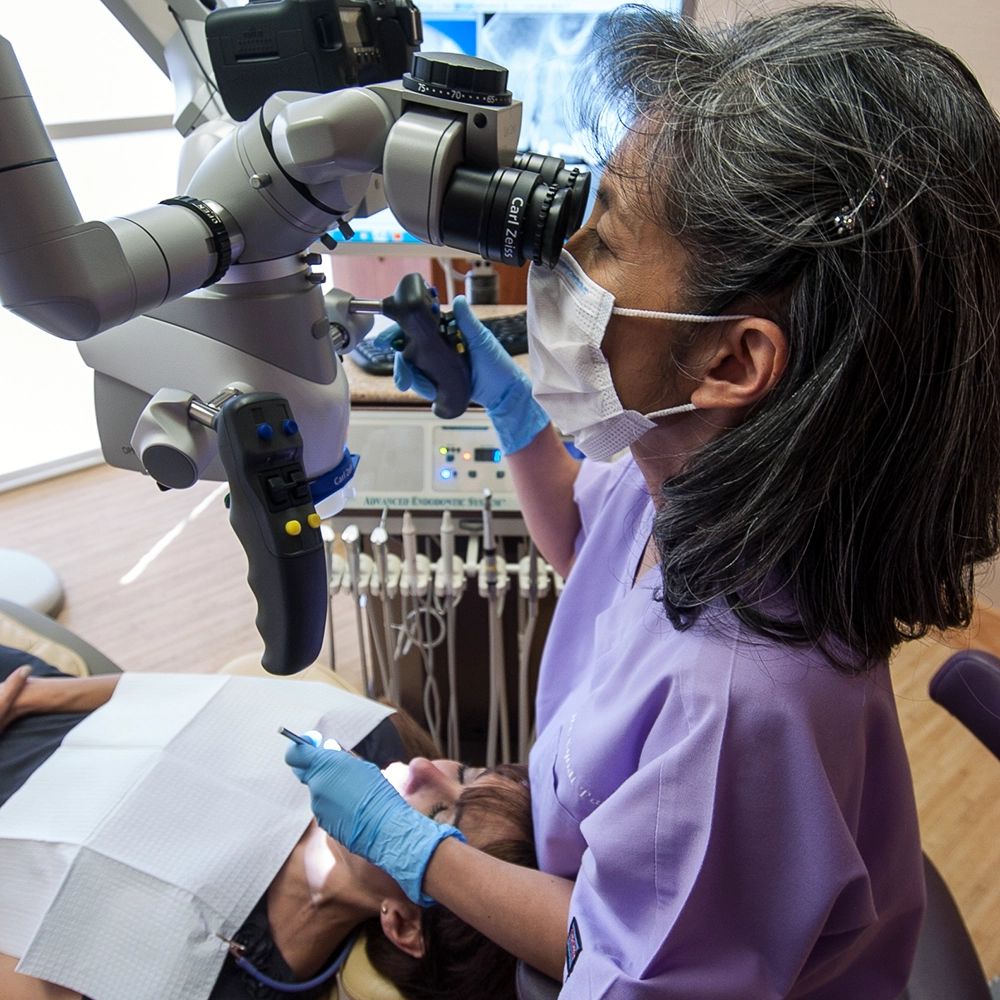 Dr. Cynthia performing dental procedures